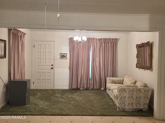 living area featuring carpet flooring and ornamental molding