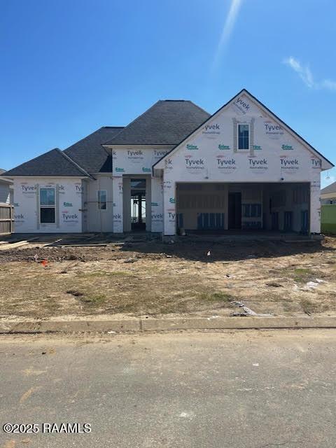 unfinished property with a garage