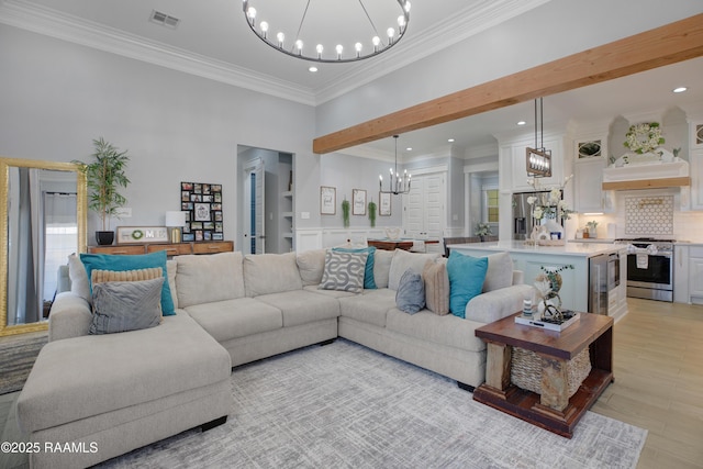 living area with light wood-type flooring, visible vents, a notable chandelier, ornamental molding, and recessed lighting