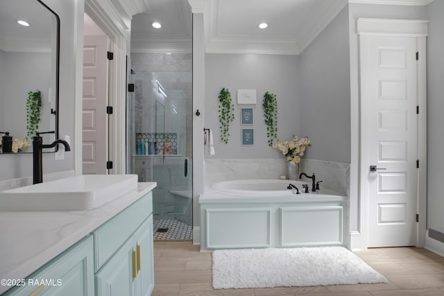 full bathroom with a stall shower, crown molding, a garden tub, and wood tiled floor