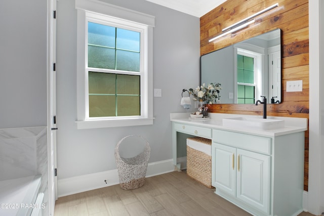 bathroom featuring vanity and baseboards