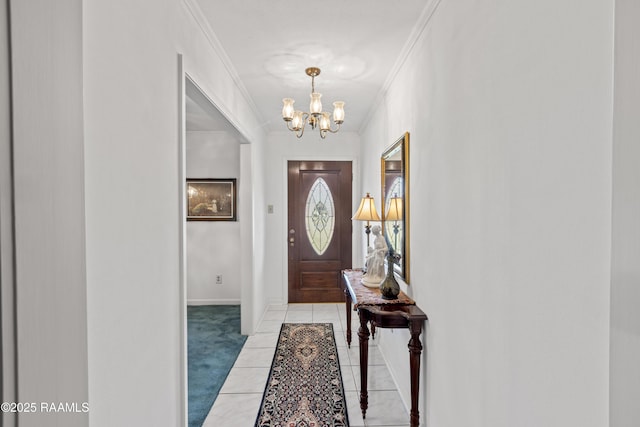 foyer featuring light tile patterned floors, baseboards, crown molding, a notable chandelier, and light colored carpet