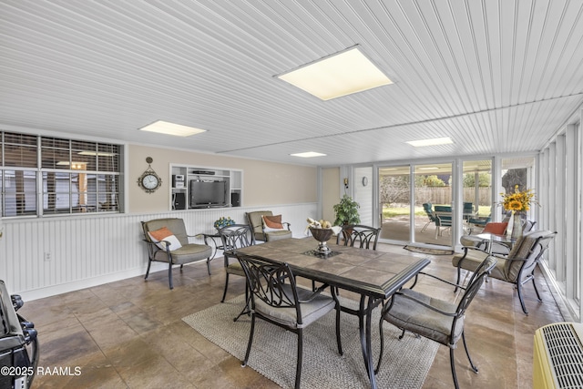 dining room featuring wainscoting