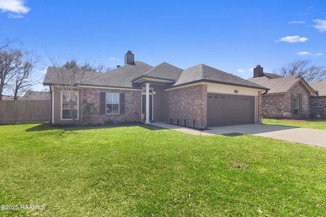 view of front of property with a front yard, a chimney, concrete driveway, a garage, and brick siding