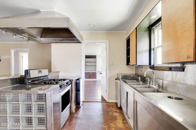 kitchen with stainless steel gas stove, stainless steel countertops, concrete floors, wall chimney exhaust hood, and baseboards