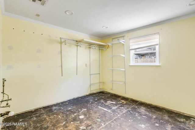 interior space featuring visible vents and crown molding