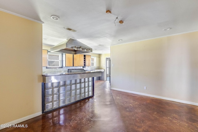 kitchen with visible vents, baseboards, and finished concrete flooring