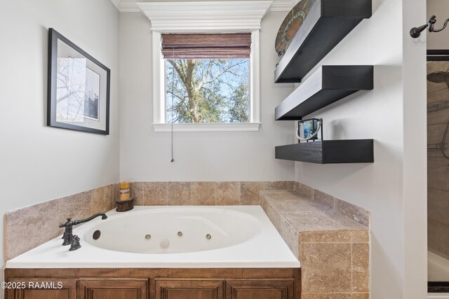 full bathroom featuring a whirlpool tub and ornamental molding