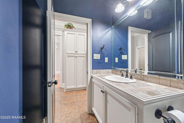 bathroom with vanity and tile patterned floors