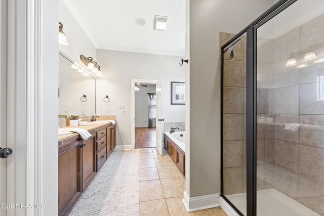 bathroom with double vanity, ornamental molding, a shower stall, and tile patterned flooring