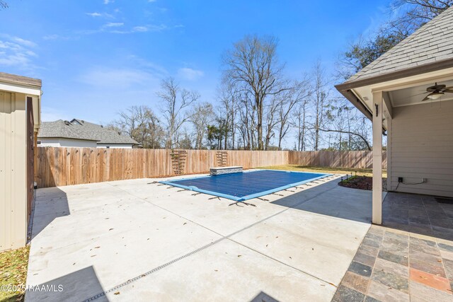 view of pool featuring a patio area and a fenced backyard