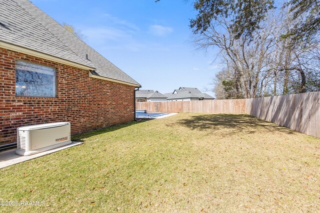 view of yard featuring a fenced backyard