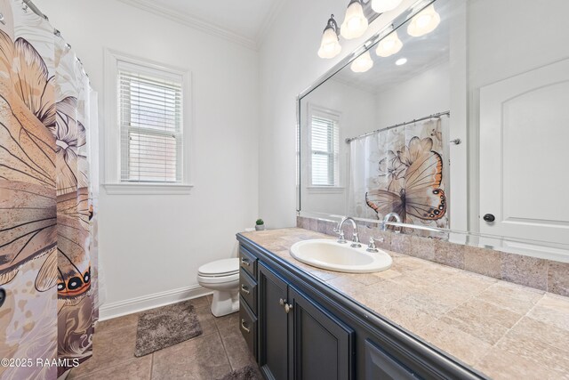 full bathroom featuring toilet, ornamental molding, tile patterned flooring, baseboards, and vanity