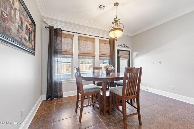 dining area featuring visible vents, crown molding, and baseboards