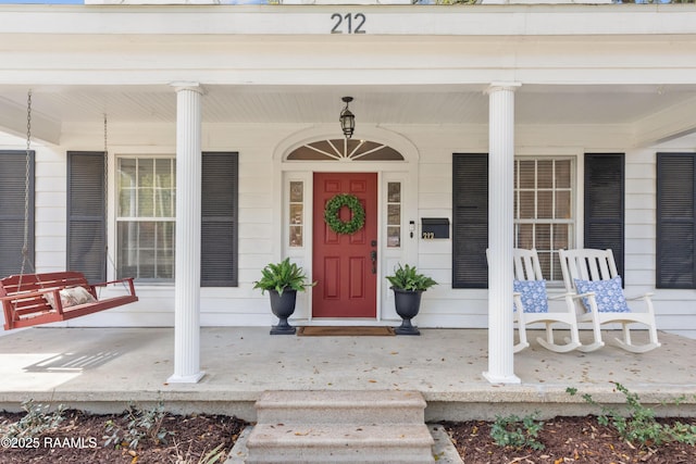 entrance to property featuring a porch