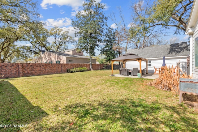 view of yard featuring a gazebo, a patio area, and a fenced backyard