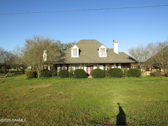 exterior space featuring a front lawn and a chimney