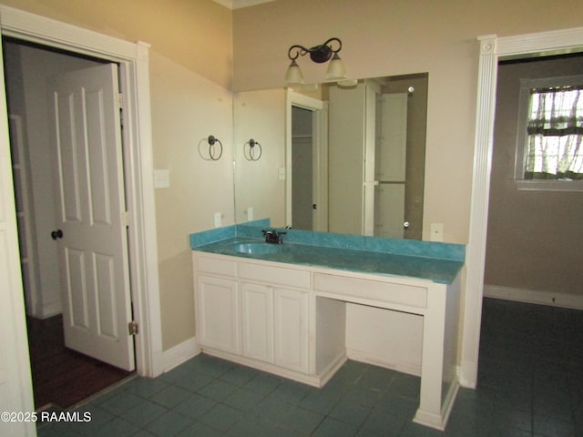 bathroom with baseboards and vanity