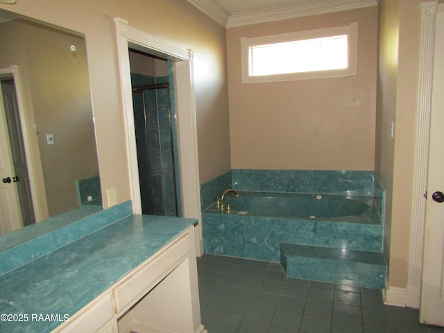 bathroom with vanity, tile patterned floors, a garden tub, and ornamental molding