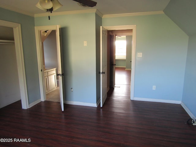 unfurnished bedroom featuring crown molding, wood finished floors, and baseboards