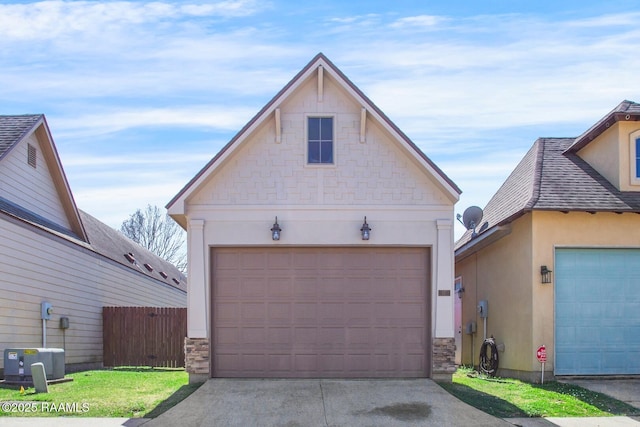 garage with central AC and fence