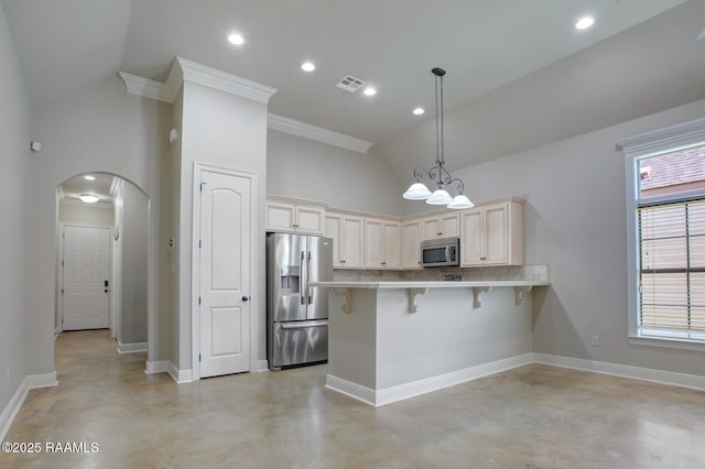 kitchen with visible vents, a breakfast bar, a peninsula, stainless steel appliances, and light countertops