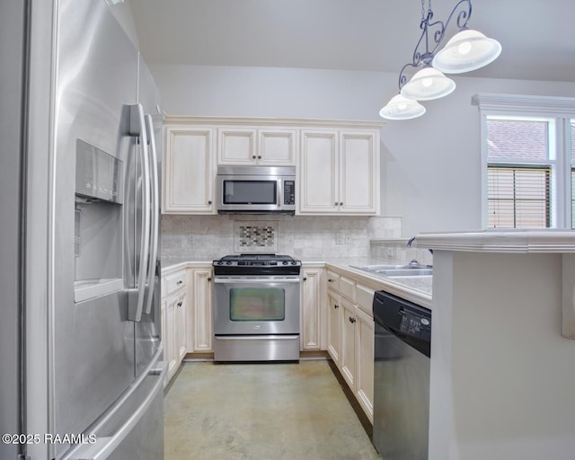 kitchen with a sink, tasteful backsplash, appliances with stainless steel finishes, and light countertops