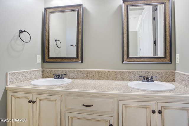 full bath with double vanity and a sink