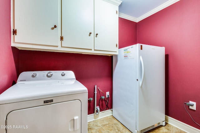 washroom with washer / dryer, cabinet space, baseboards, and ornamental molding