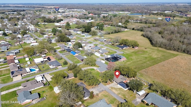 birds eye view of property with a residential view