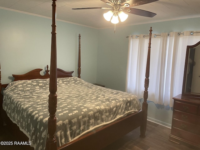 bedroom featuring ceiling fan, wood finished floors, and ornamental molding