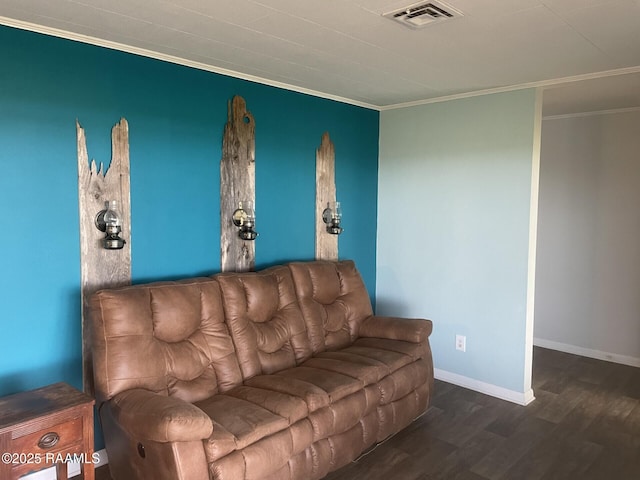 living area with visible vents, baseboards, wood finished floors, and ornamental molding