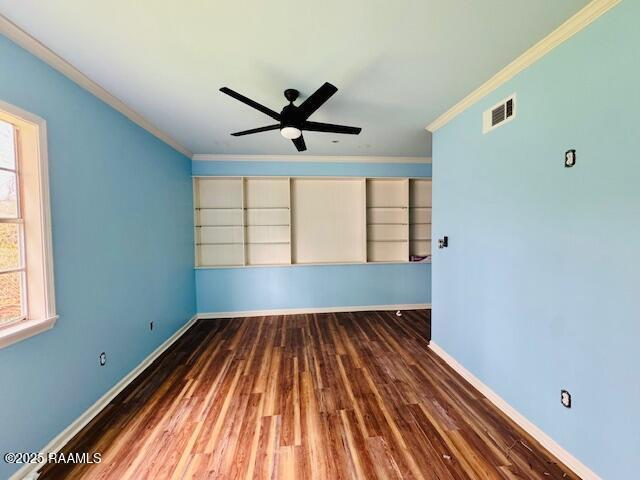 224 W Cherry St, Opelousas, LA 70570 - spare room with crown molding, visible vents, and baseboards