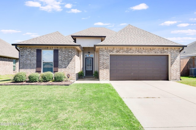 view of front of house featuring brick siding, a shingled roof, concrete driveway, a front yard, and an attached garage