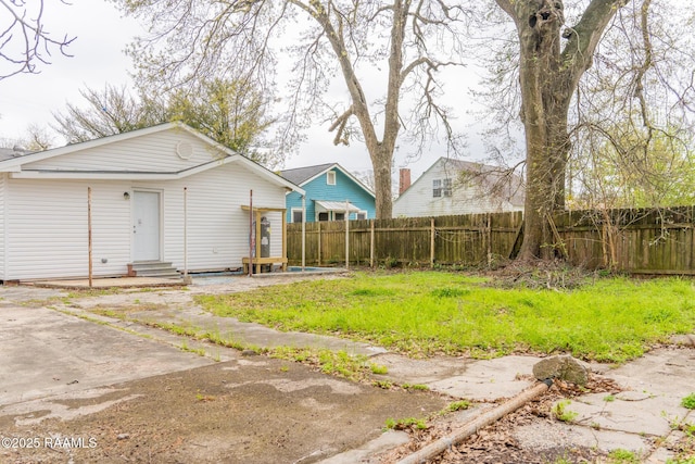 exterior space featuring fence and entry steps