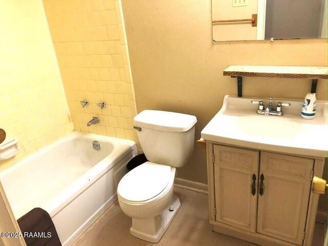 bathroom featuring shower / bath combination, toilet, vanity, and baseboards