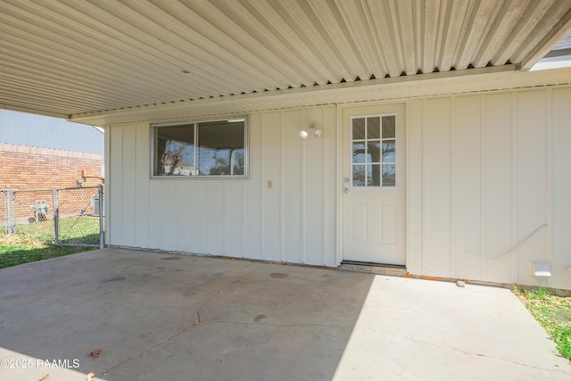 view of patio featuring a gate and fence