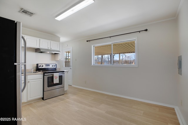 kitchen featuring under cabinet range hood, visible vents, appliances with stainless steel finishes, and a wealth of natural light