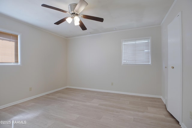 unfurnished room with light wood-type flooring, baseboards, ornamental molding, and a ceiling fan