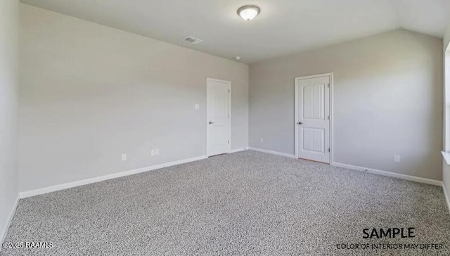 carpeted empty room featuring visible vents and baseboards