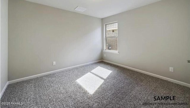 carpeted empty room with baseboards