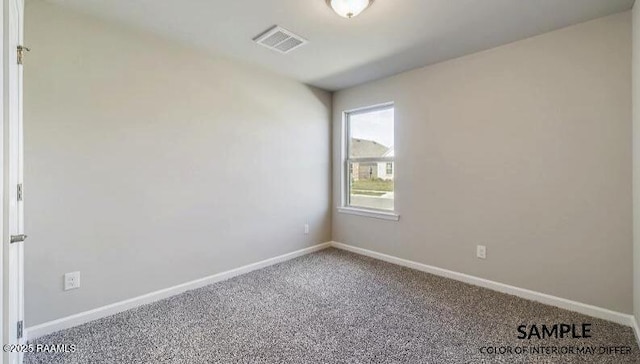 carpeted spare room featuring visible vents and baseboards