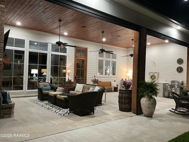 view of patio featuring a grill, a ceiling fan, and an outdoor hangout area