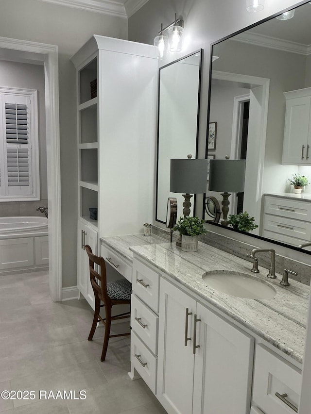 full bathroom with vanity, a garden tub, and ornamental molding