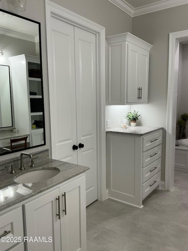 bathroom with vanity and crown molding