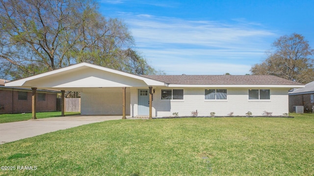 ranch-style home featuring cooling unit, driveway, a front lawn, a carport, and brick siding