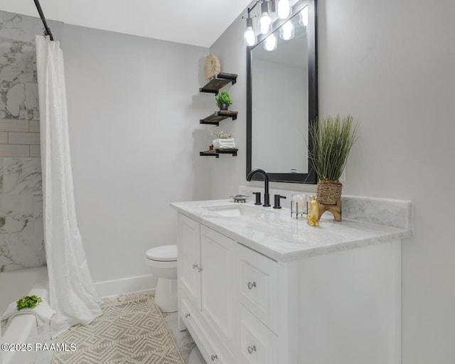 full bathroom featuring vanity, toilet, baseboards, and marble finish floor