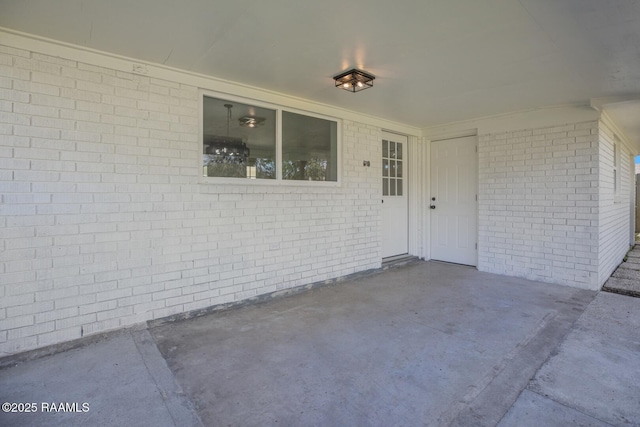 entrance to property featuring a patio