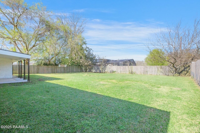 view of yard featuring a patio and a fenced backyard