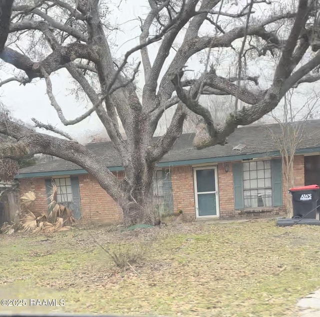 view of front of home featuring brick siding